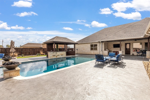 view of swimming pool featuring a gazebo and a patio area