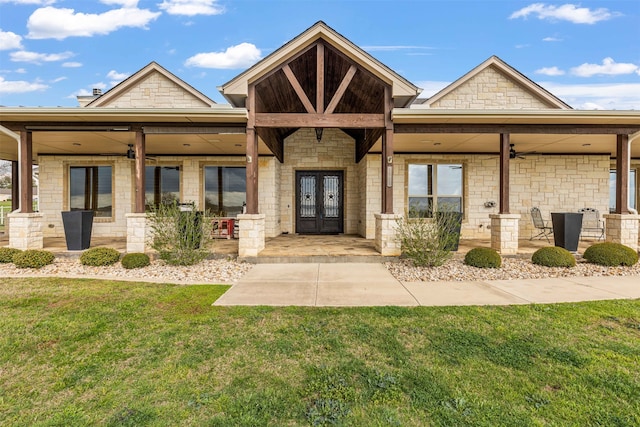 craftsman inspired home with french doors and a front lawn