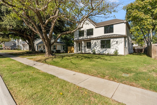 view of front of home featuring a front lawn