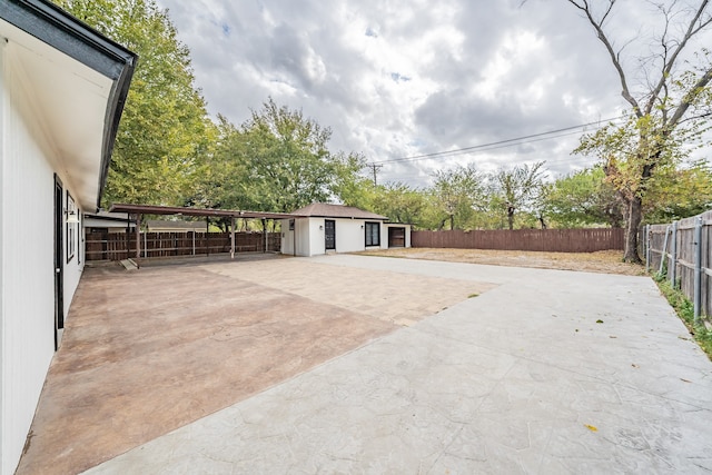 view of patio / terrace featuring a storage shed