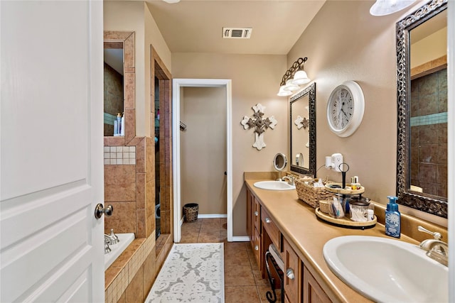 bathroom featuring vanity, tile patterned floors, and shower with separate bathtub