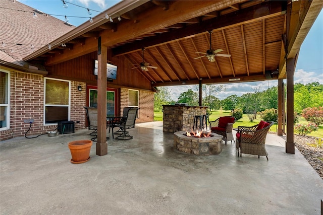 view of patio featuring an outdoor fire pit and ceiling fan