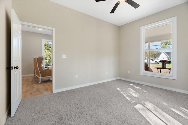 unfurnished room with carpet floors and ceiling fan