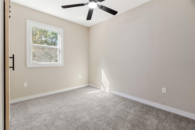 carpeted empty room with ceiling fan