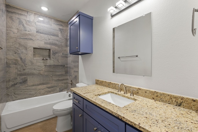 full bathroom featuring toilet, tiled shower / bath combo, and vanity