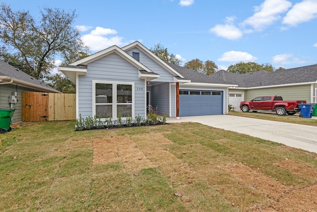 view of front of home with a garage and a front yard