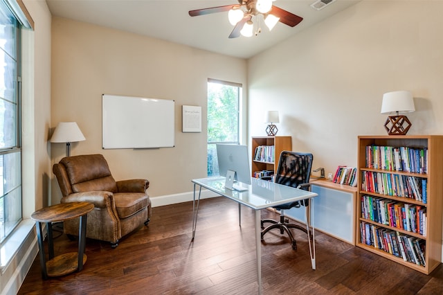 office space featuring dark wood-type flooring, vaulted ceiling, and ceiling fan