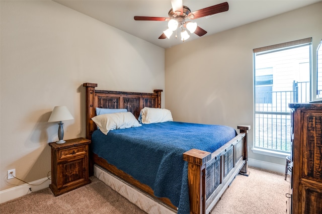 bedroom with ceiling fan and light colored carpet