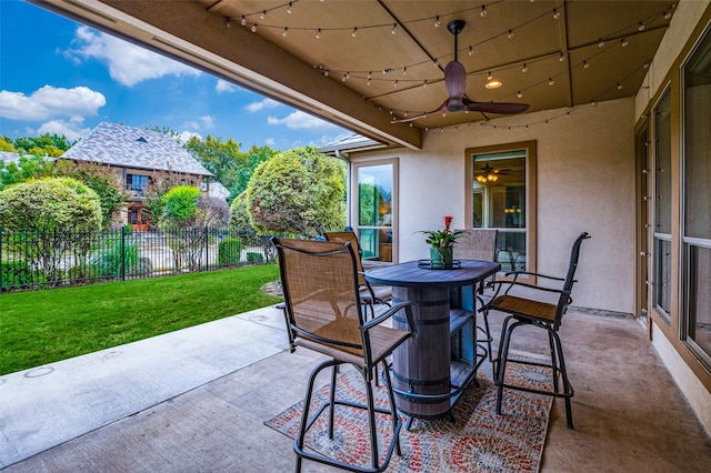 view of patio featuring ceiling fan