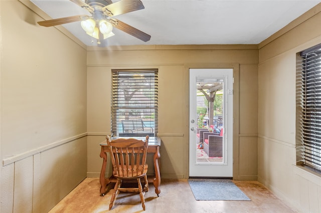 doorway with ceiling fan