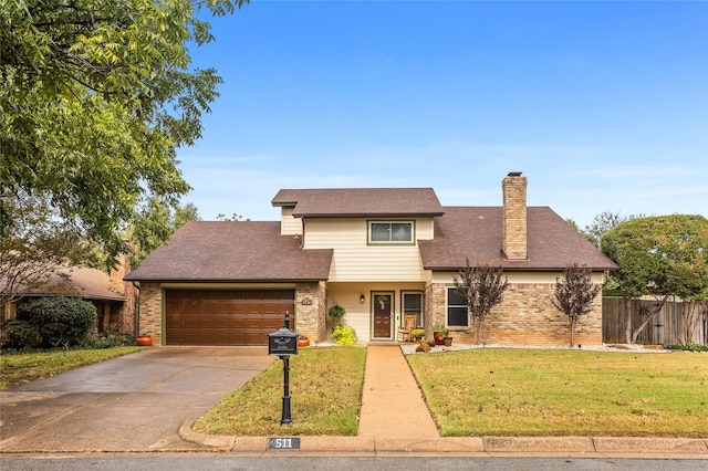 view of front property featuring a garage and a front yard