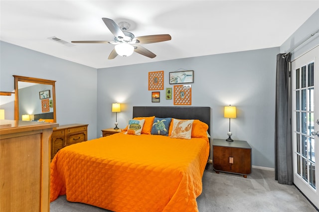 bedroom featuring ceiling fan and light carpet