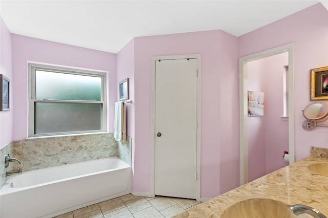 bathroom with vanity, tile patterned floors, and a bathing tub