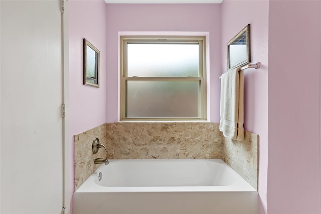 bathroom with a tub to relax in