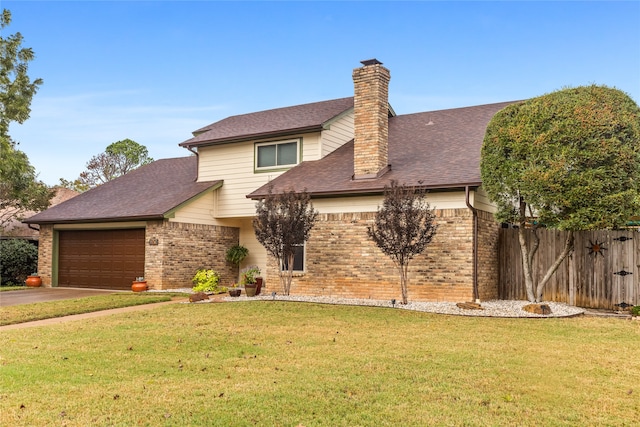 view of front of property with a garage and a front yard