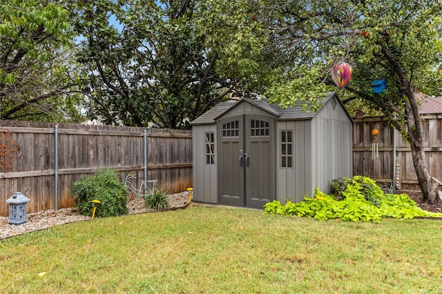 view of outbuilding featuring a yard