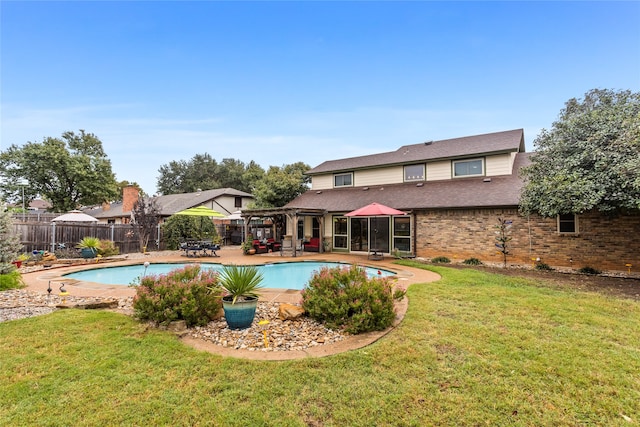 view of pool featuring a pergola, a lawn, and a patio area