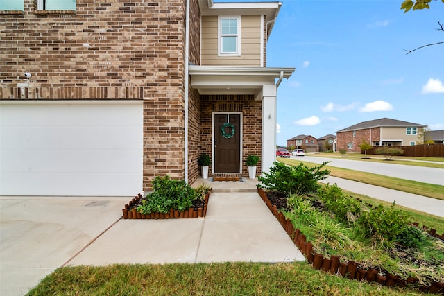 entrance to property featuring a garage