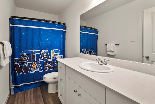 bathroom featuring vanity, a shower with shower curtain, toilet, and wood-type flooring