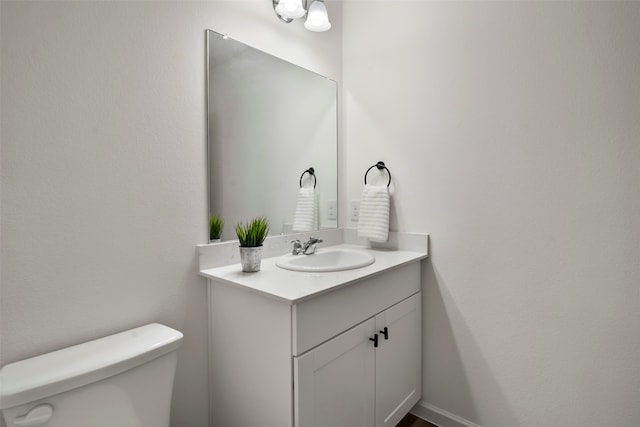 bathroom with vanity and toilet