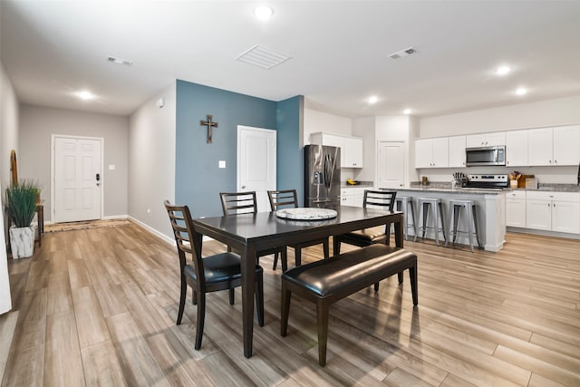 dining area featuring light hardwood / wood-style flooring