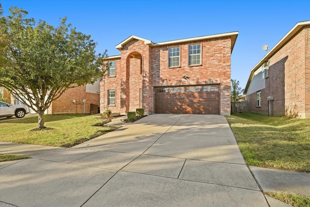 view of front property featuring a front yard and a garage