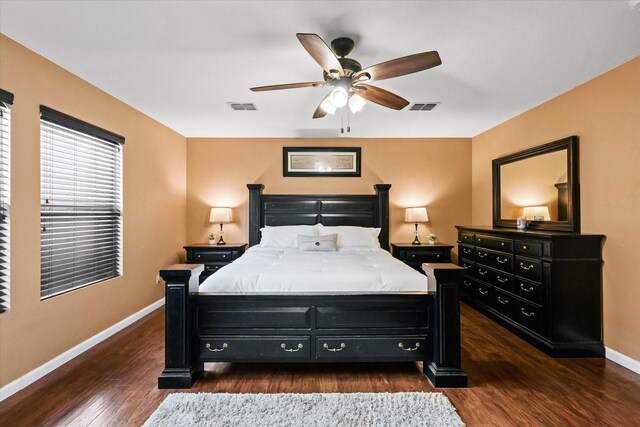 bedroom with ceiling fan and dark wood-type flooring