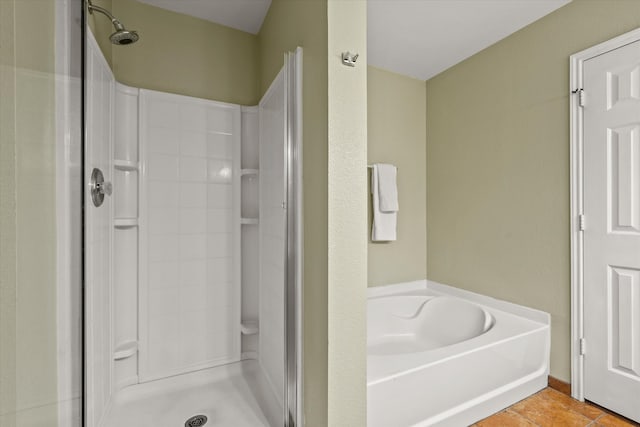 bathroom with tile patterned flooring and plus walk in shower