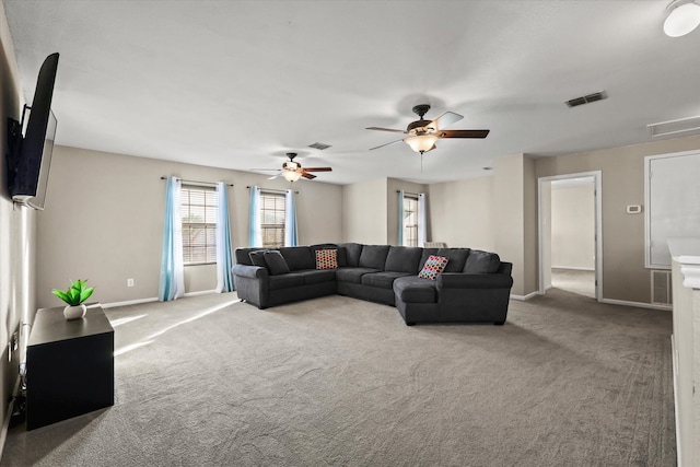 living room with carpet and ceiling fan