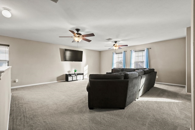 living room with ceiling fan and carpet floors