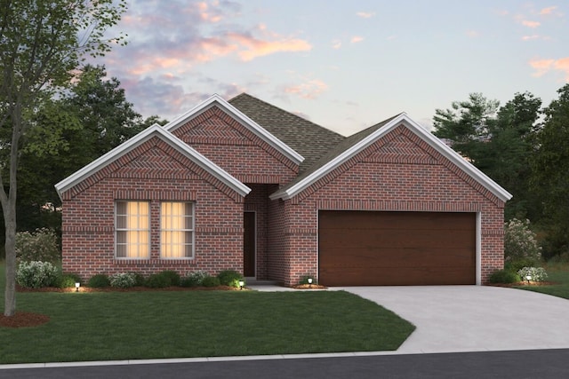 view of front of home featuring a garage and a lawn