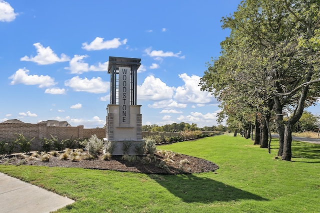 view of property's community with a lawn