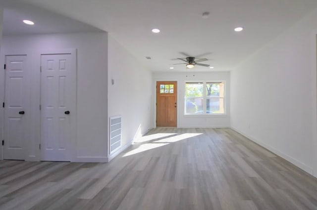 foyer featuring ceiling fan and light wood-type flooring