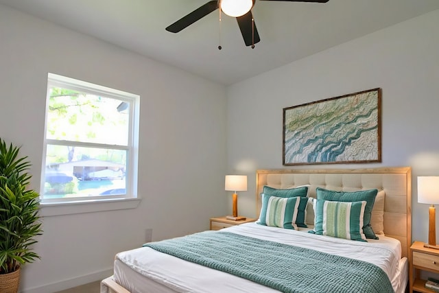 bedroom with multiple windows and ceiling fan