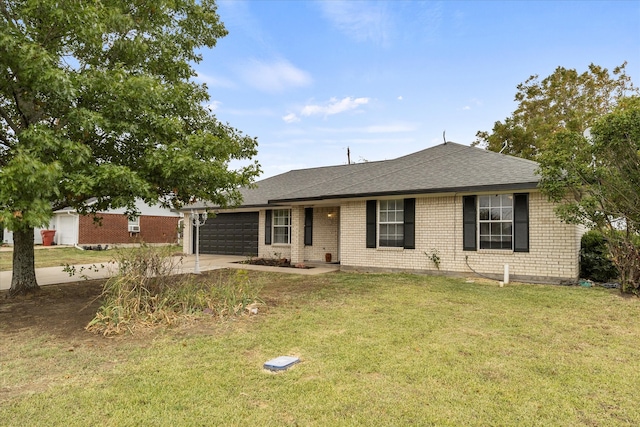 ranch-style home featuring a front lawn and a garage