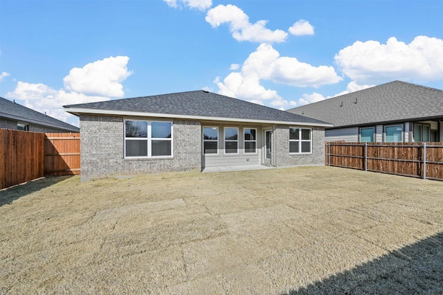 rear view of house with a lawn