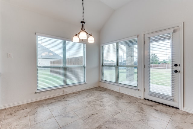 unfurnished dining area with lofted ceiling