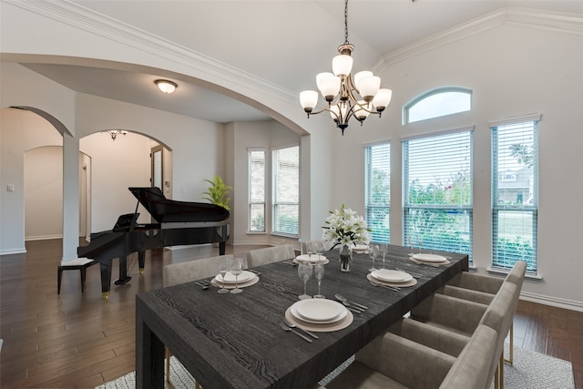 dining space with ornamental molding, dark hardwood / wood-style flooring, a chandelier, and a wealth of natural light