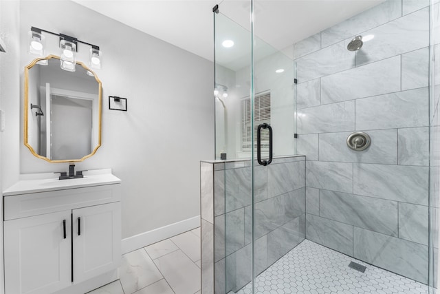 bathroom featuring vanity and a shower with shower door