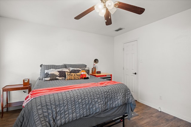 bedroom featuring dark hardwood / wood-style flooring and ceiling fan