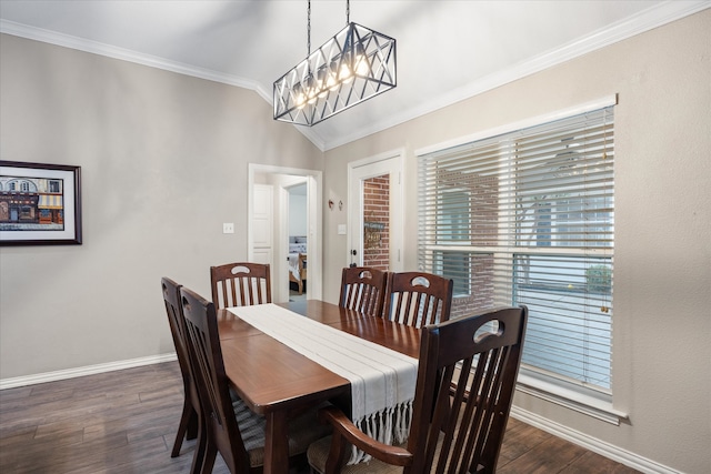 dining room featuring a chandelier, dark hardwood / wood-style floors, and crown molding