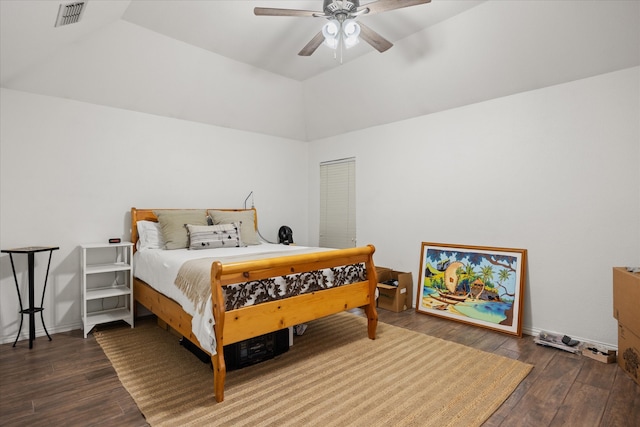 bedroom with vaulted ceiling, ceiling fan, and dark hardwood / wood-style flooring