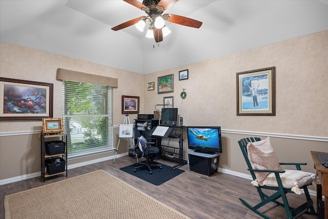 home office with lofted ceiling, dark wood-type flooring, and ceiling fan