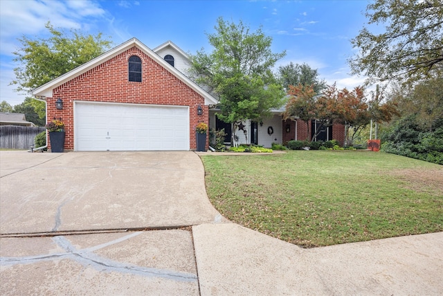 view of front of property with a garage and a front yard