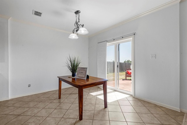 interior space featuring a notable chandelier, crown molding, and light tile patterned flooring