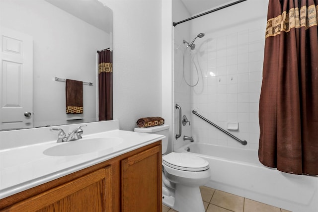 full bathroom featuring tile patterned flooring, vanity, toilet, and shower / tub combo