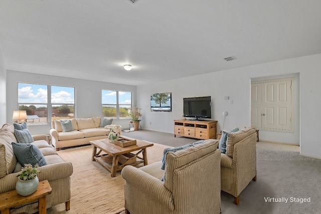 living room featuring light colored carpet