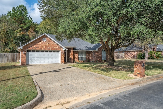 view of front of house featuring a garage and a front yard