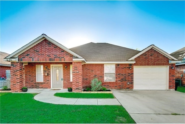 view of front facade with a garage and a front yard