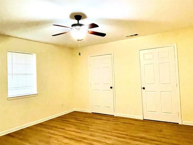 unfurnished bedroom with hardwood / wood-style flooring and ceiling fan